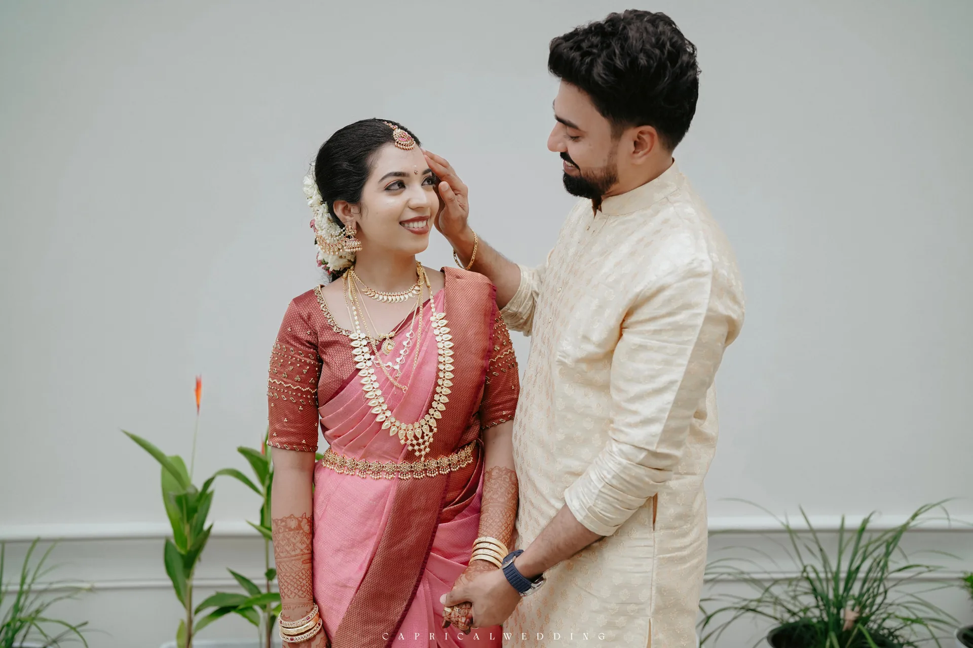 A couple sharing a gentle wedding moment